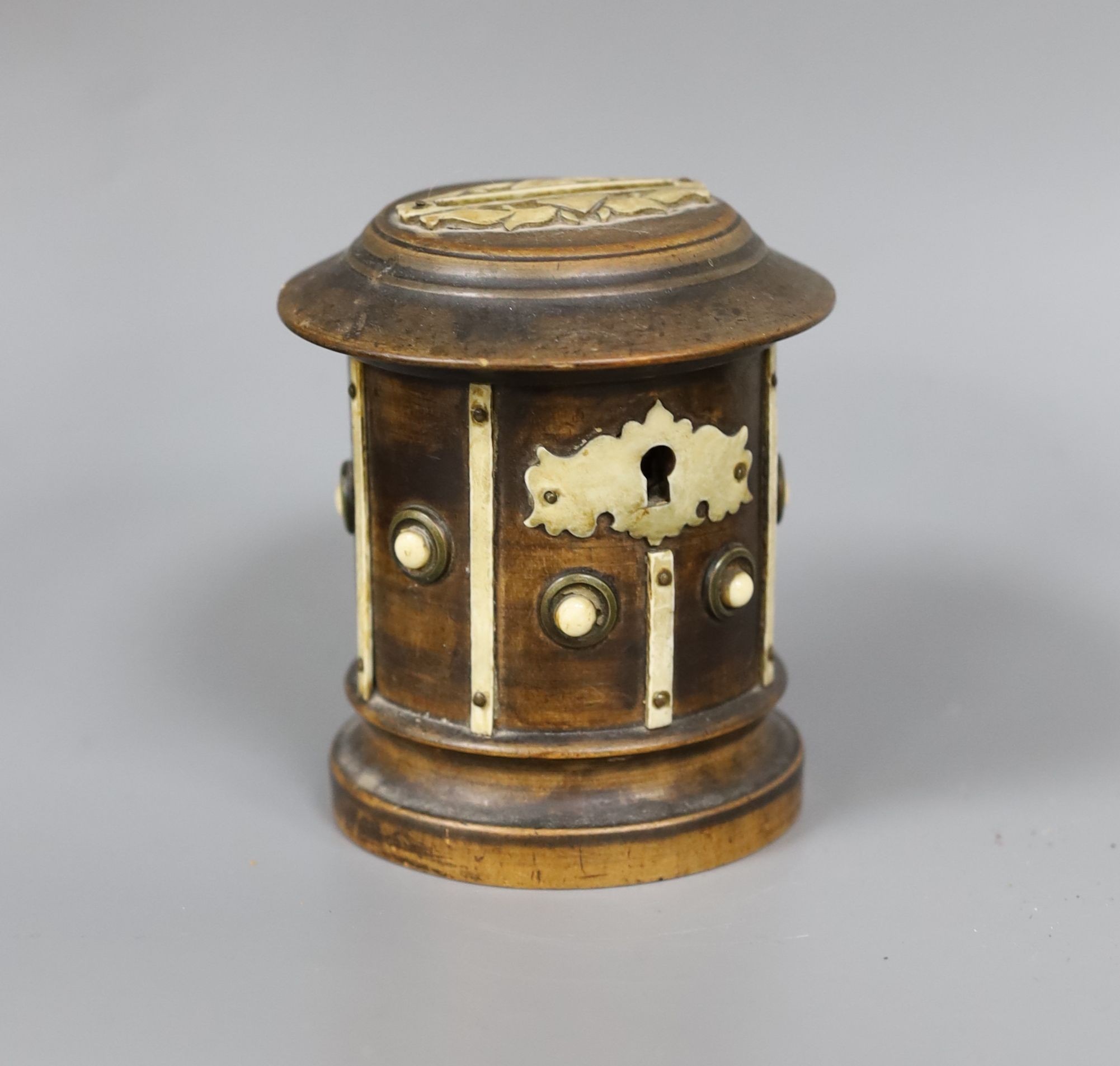 A 19th century ebonised walnut money bank, 9.5cm